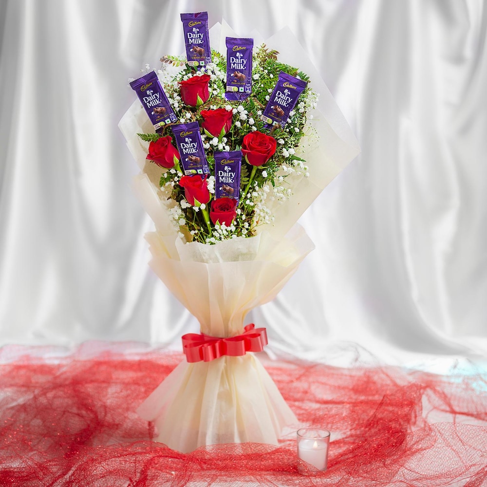 Ro. 48 499( 6 pcs Red roses with 6 cadbury Dairy Milk cover with White paper)